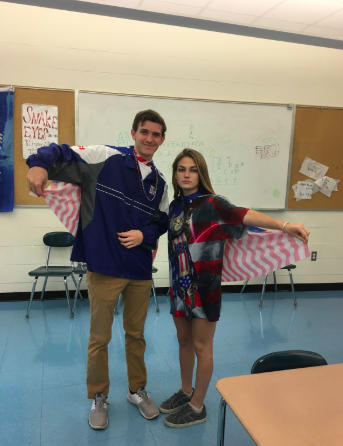 Seniors+Nick+Hoyt+and+Caroline+Cooney+show+off+their+American+flag+capes+in+class.+