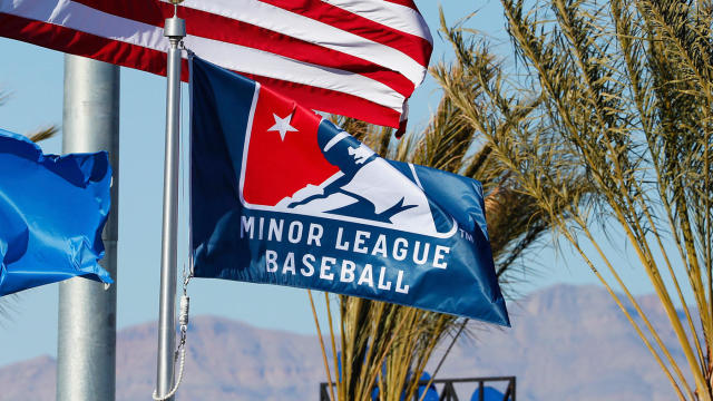 LAS VEGAS, NV - MARCH 08: The American flag waves in the breeze along with the Nevada state flag and a Minor League Baseball flag during Big League Weekend featuring the Chicago Cubs and Cincinnati Reds on March 8, 2020 at Las Vegas Ballpark in Las Vegas, Nevada. (Photo by Jeff Speer/Icon Sportswire via Getty Images)