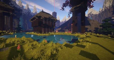 Image of Minecraft Gameplay. There is a lake next to a house.