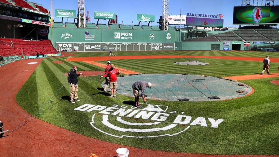 BOSTON - MARCH 30: A worker spray-paints Opening Day behind home plate at Fenway Park in Boston on March 30, 2021.  Preparations were made for Opening Day on Tuesday as workers were busy sprucing up the park and making it safe for spectators (Photo by John Tlumacki/The Boston Globe via Getty Images)
