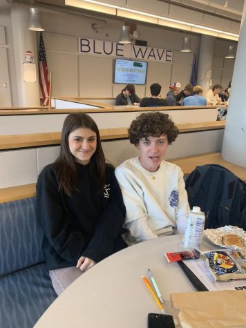 girl and boy sititing at lunch table