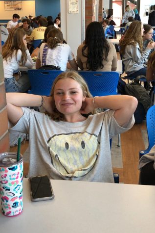 Girl sitting in a chair smiling