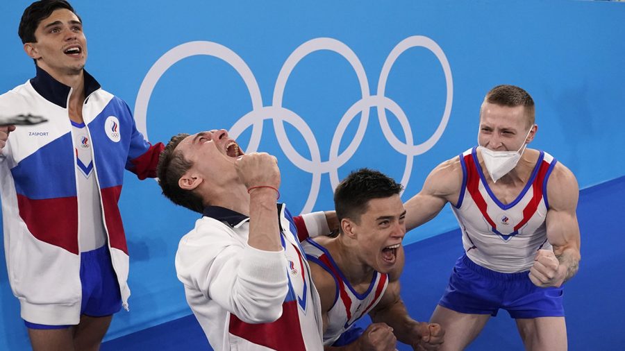 Russian Olympic Committees artistic gymnastics mens team celebrating a joyful victory together
