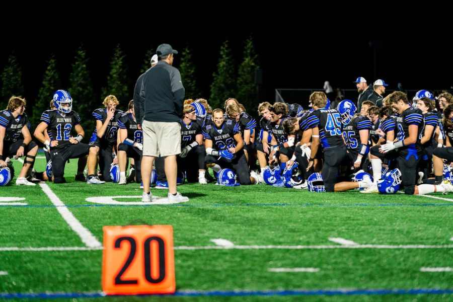 Darien huddles after the 21-9 loss to Maloney at the DHS Stadium Field Friday night.