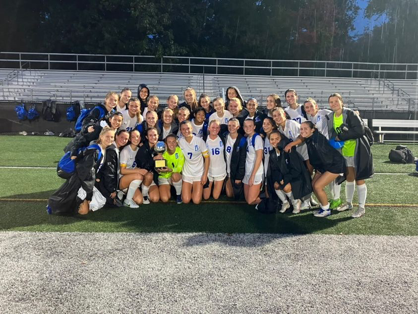 The Darien girls soccer team celebrating after the Rivals Cup win at Dunning Field
