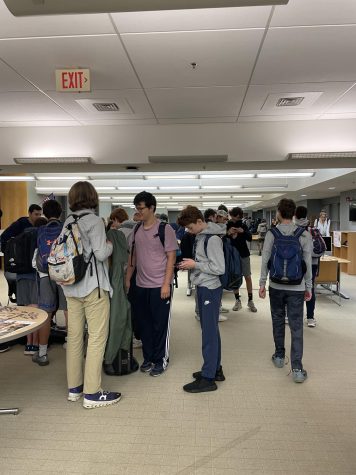 Students congregate in the library entrance before school starts.
