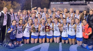 The Darien Field Hockey celebrating after the FCIAC Championship win at Casagrande Field