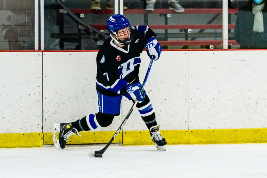 Returning varsity player Charlie Schwind taking a slap shot from the blue line at the Wonderland of Ice on Wednesday
