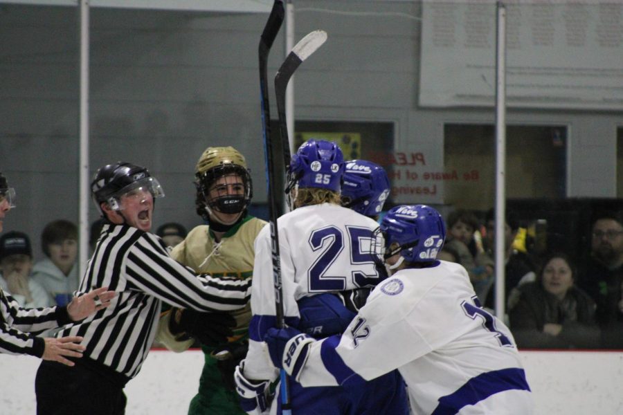 Dariens Tommy Branca in a post play scrum against Notre Dame inside the Darien Ice House