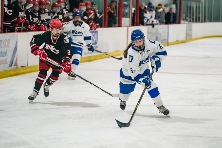 Dariens Skylar Ravosa taking the puck across the blue line in a win over New Canaan