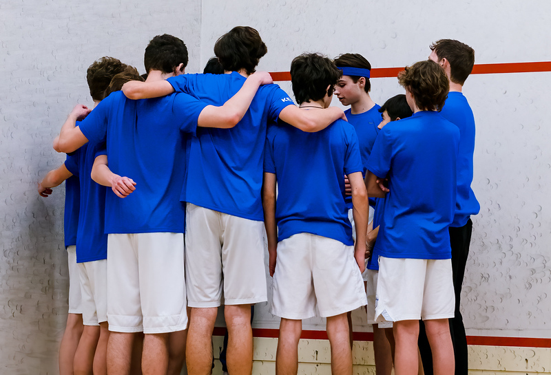 Darien Boys Squash team huddling up before a Tuesday Night clash with Staples at Chelsea Piers