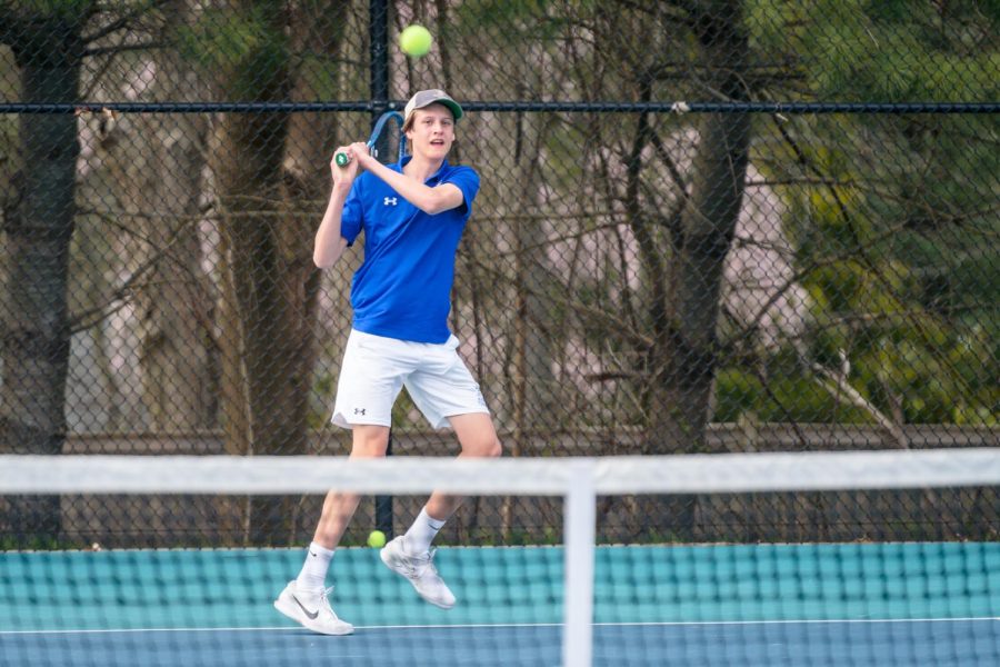 Darien senior captain Teddy Callery hitting the ball at the DHS Tennis Courts.