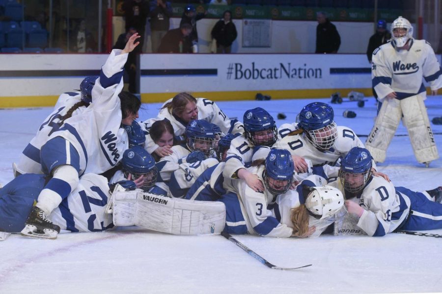 The 2023 CT High School Girls Ice Hockey state champion Darien Blue Wave storming the Ice inside M&T Bank Arena