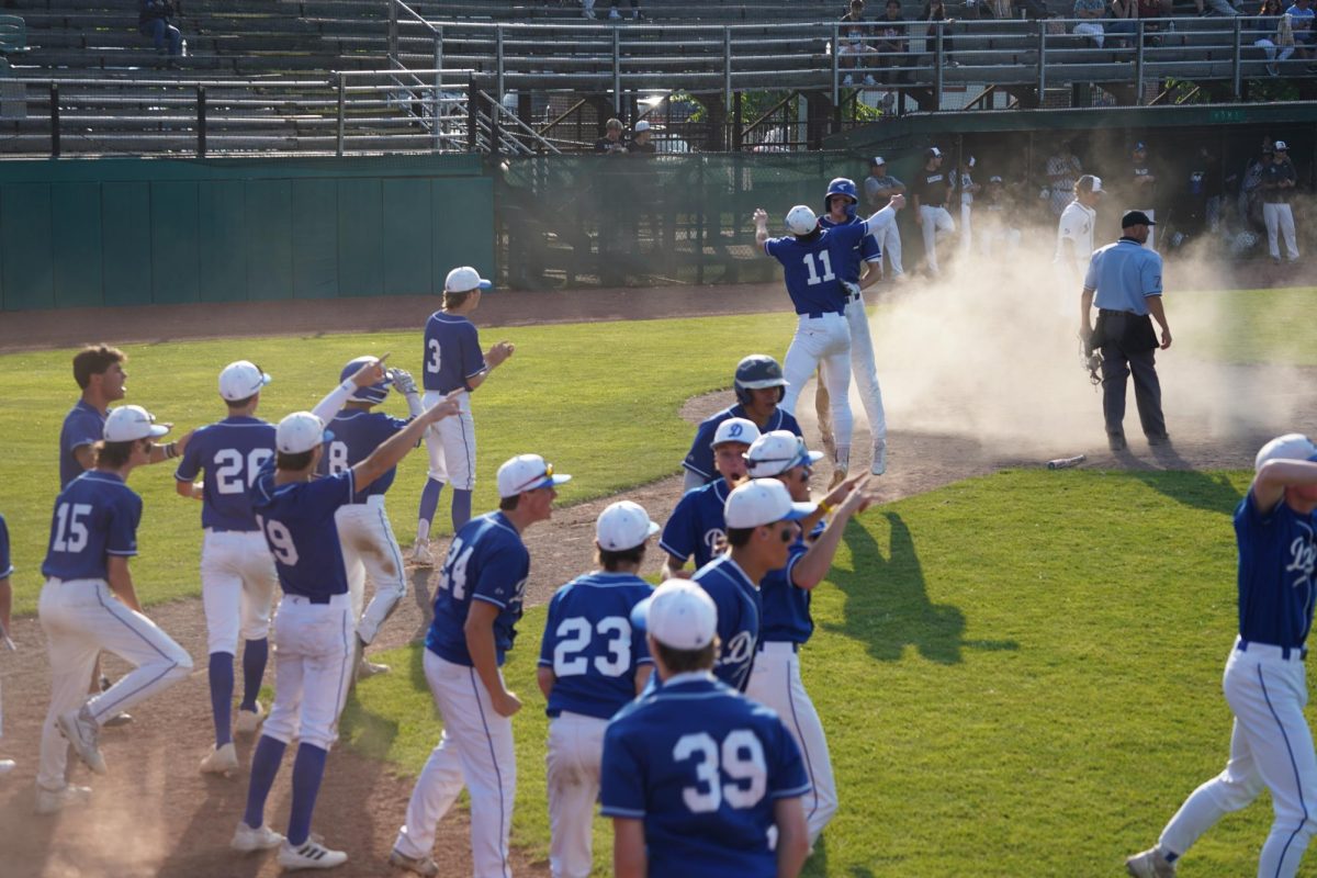 The+Darien+Baseball+team+celebrating+a+go-ahead+run+in+the+top+of+the+ninth+in+the+state+tournament+at+Palmer+Field.