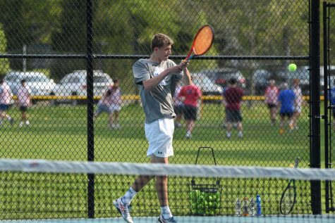 Darien senior captain Sam Donnelly with the forehand in a 2023 home win over Wilton