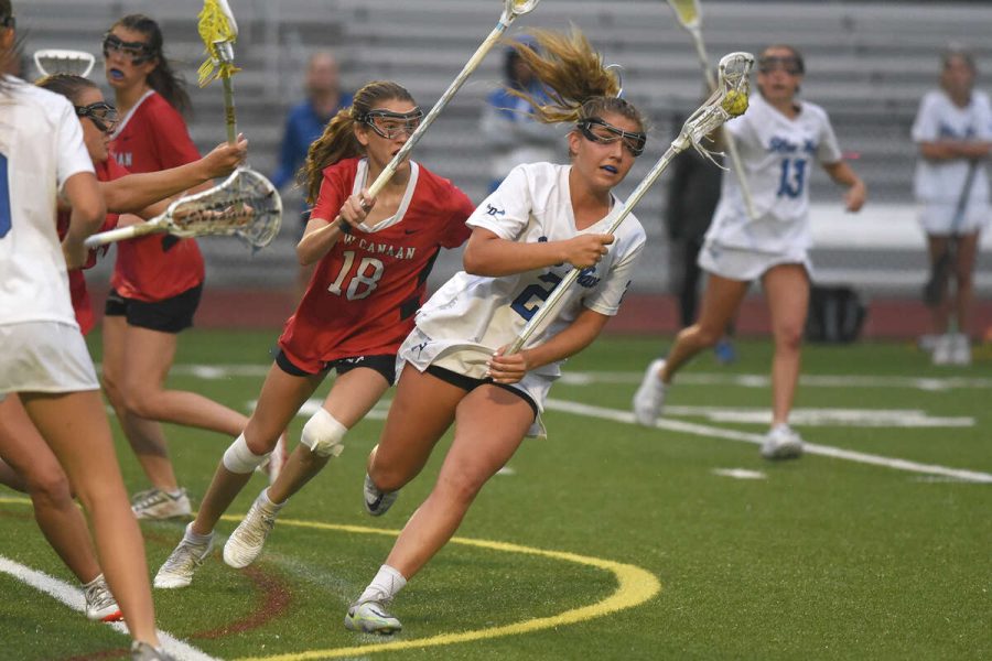 Darien senior captain Chloe Humphrey with control of the ball at Cardinal Stadium in the 2023 FCIAC Girls Lacrosse Championship