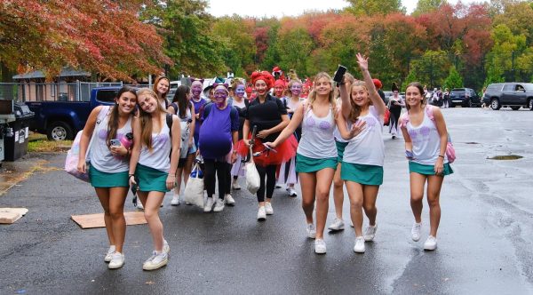 Members of DHS girls sports teams walking into school for BWP Day during Spirit Week. Fridays BWP celebration is the most successful of the spirit day themes.