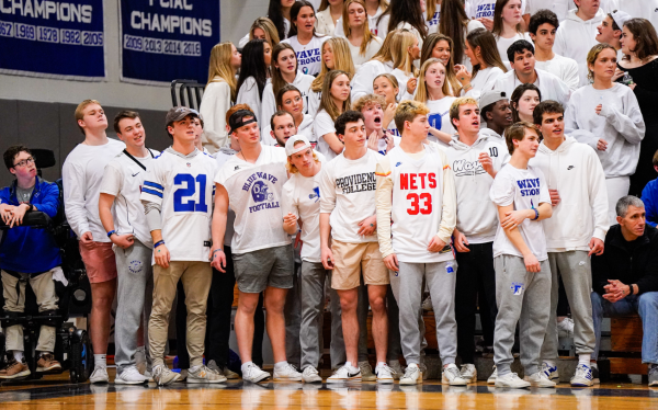 DHS Students come together dressed in white to cheer on our players in a heated game. 