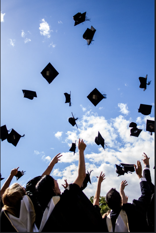 Graduates throw their caps in the air as they prepare to move onto their next stage in life