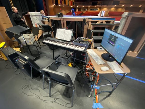 This year's pit isn't a traditional orchestra, but a rock band. (Kayla Huang)